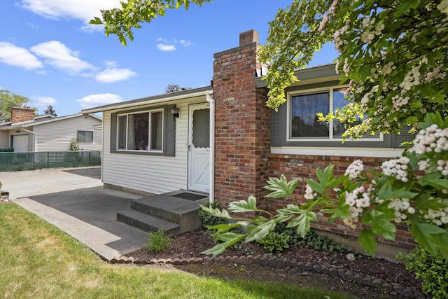 13304 E Desmet Ave, Spokane Valley, WA 99216 - view of front of home with a chimney and a patio area