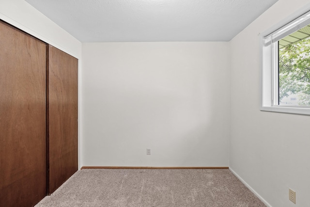 13304 E Desmet Ave, Spokane Valley, WA 99216 - unfurnished bedroom featuring carpet flooring, a closet, and baseboards