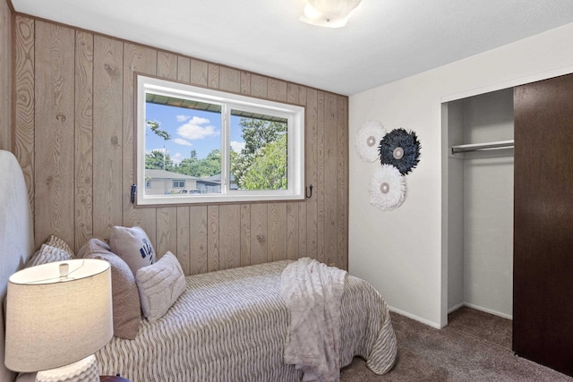 13304 E Desmet Ave, Spokane Valley, WA 99216 - carpeted bedroom with wooden walls, a closet, and baseboards