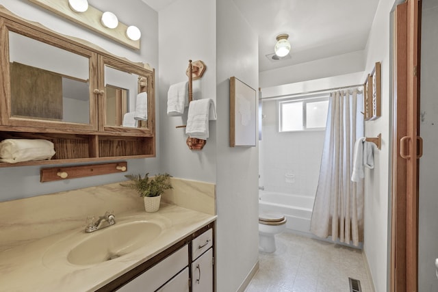 13304 E Desmet Ave, Spokane Valley, WA 99216 - bathroom featuring toilet, vanity, shower / tub combo, and tile patterned floors