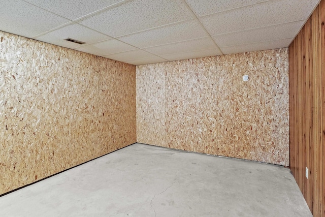 13304 E Desmet Ave, Spokane Valley, WA 99216 - unfurnished room with wood walls, a paneled ceiling, and concrete flooring