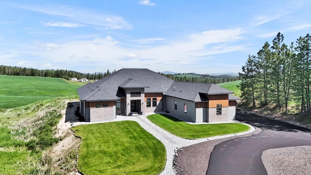 5110 W Hayden Ln, Spokane, WA 99208 - rear view of property with a lawn and roof with shingles