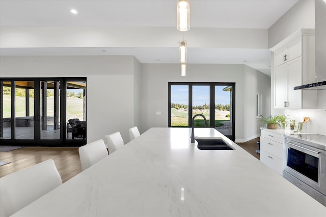 5110 W Hayden Ln, Spokane, WA 99208 - kitchen featuring a sink, french doors, plenty of natural light, pendant lighting, and recessed lighting