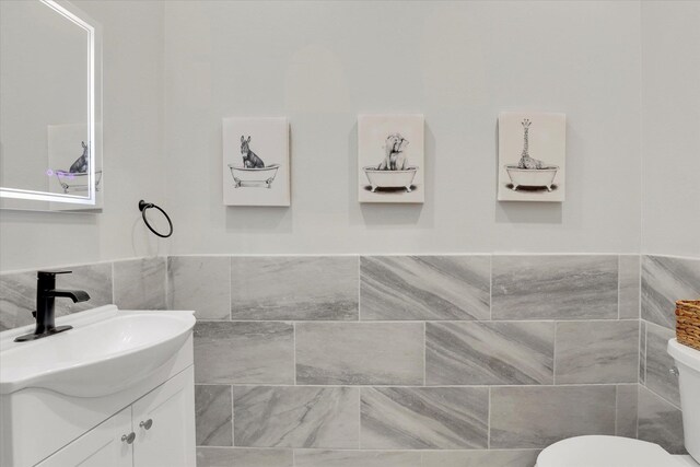 5110 W Hayden Ln, Spokane, WA 99208 - half bath with tile walls, vanity, and toilet
