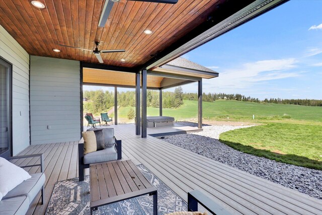 5110 W Hayden Ln, Spokane, WA 99208 - wooden terrace featuring a patio area, a ceiling fan, and a lawn