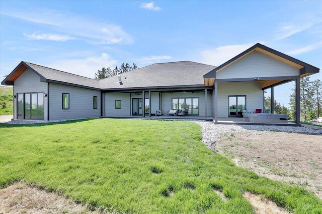 5110 W Hayden Ln, Spokane, WA 99208 - rear view of property with a hot tub, a patio, a yard, and a shingled roof