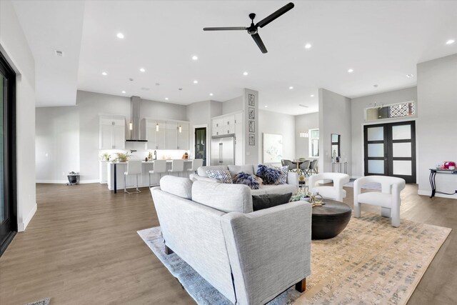 5110 W Hayden Ln, Spokane, WA 99208 - living area featuring ceiling fan, wood finished floors, baseboards, recessed lighting, and a high ceiling