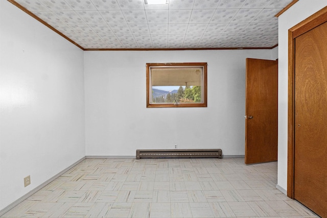 705 Old Kettle Rd, Kettle Falls, WA 99114 - spare room featuring ornamental molding, a baseboard radiator, and baseboards