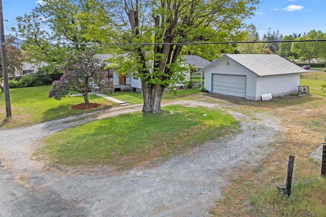 705 Old Kettle Rd, Kettle Falls, WA 99114 - view of front of home featuring a garage, an outdoor structure, a front lawn, and metal roof