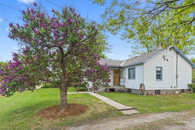 705 Old Kettle Rd, Kettle Falls, WA 99114 - ranch-style house with a chimney, a front lawn, and a shingled roof