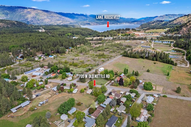 705 Old Kettle Rd, Kettle Falls, WA 99114 - aerial view of property and surrounding area with a water and mountain view and a heavily wooded area