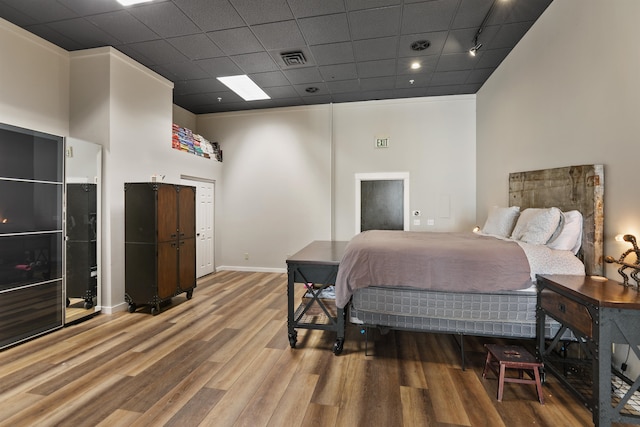423 W 1st Ave Unit 110, Spokane, WA 99201 - bedroom featuring wood finished floors and baseboards