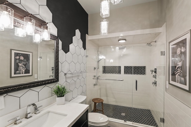 423 W 1st Ave Unit 110, Spokane, WA 99201 - full bathroom with tile walls, vanity, toilet, and a shower stall