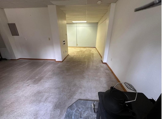 2267 Hawks Rd, Colville, WA 99114 - unfurnished living room featuring carpet, a paneled ceiling, and baseboards