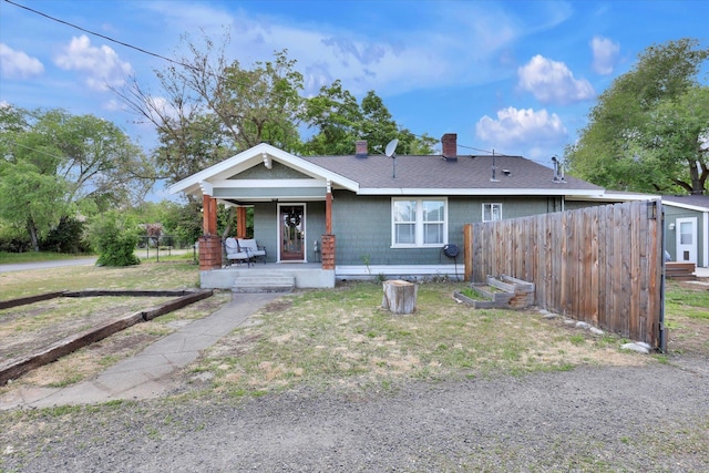 7311 E Fairview Ave, Spokane Valley, WA 99212 - view of front facade with a porch, a chimney, and a shingled roof