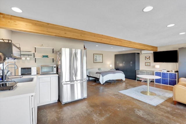7311 E Fairview Ave, Spokane Valley, WA 99212 - bedroom with freestanding refrigerator, concrete flooring, a sink, recessed lighting, and beam ceiling