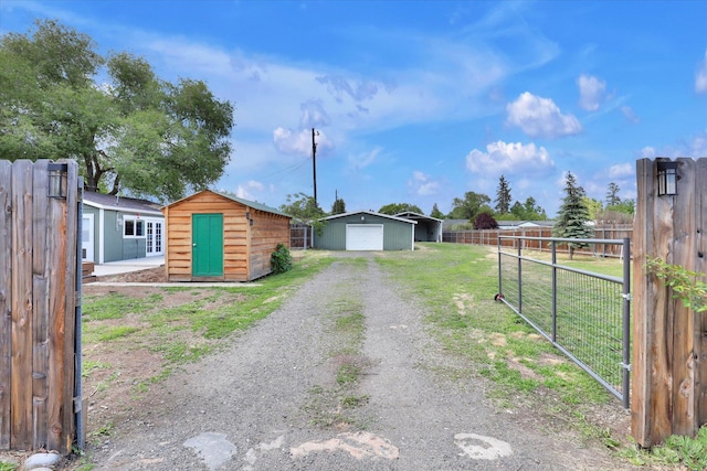 7311 E Fairview Ave, Spokane Valley, WA 99212 - view of front of home with a garage and driveway