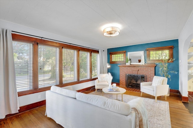 7311 E Fairview Ave, Spokane Valley, WA 99212 - living room with a brick fireplace, baseboards, and wood finished floors