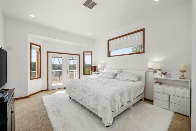 16503 W Bluebird Ln, Spokane, WA 99224 - bedroom featuring access to exterior, light carpet, french doors, baseboards, and recessed lighting