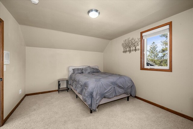 16503 W Bluebird Ln, Spokane, WA 99224 - bedroom featuring light carpet, baseboards, and lofted ceiling