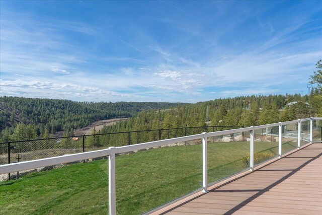 16503 W Bluebird Ln, Spokane, WA 99224 - wooden deck with a forest view