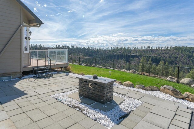 16503 W Bluebird Ln, Spokane, WA 99224 - view of patio / terrace featuring a forest view and a deck