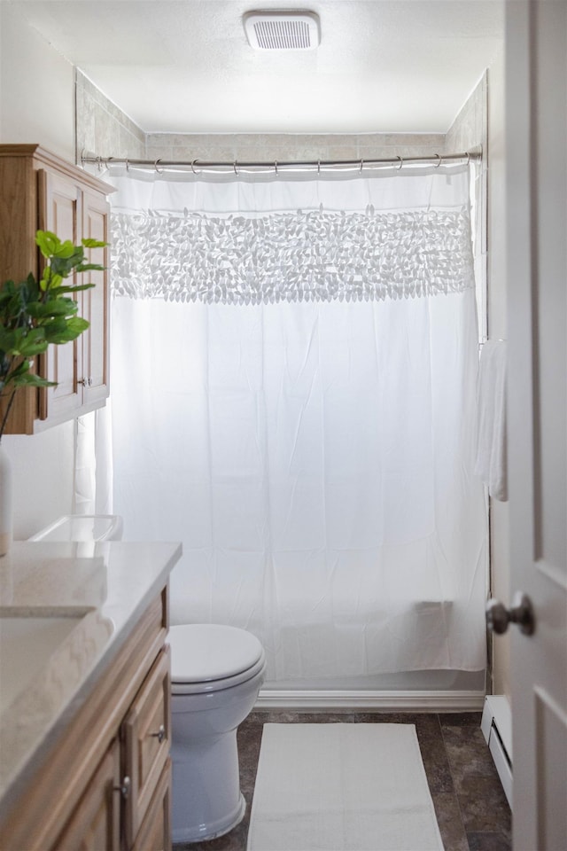 423 W Providence Ave, Spokane, WA 99205 - full bath with a baseboard heating unit, vanity, and toilet