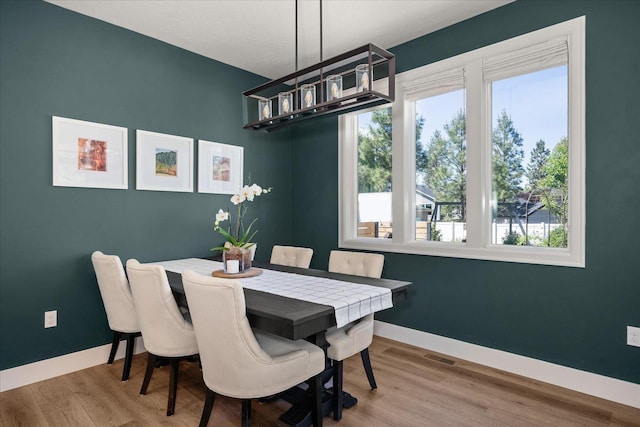 5212 W Decatur Ave, Spokane, WA 99208 - dining area with baseboards and wood finished floors