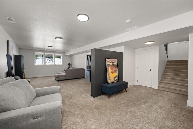 5212 W Decatur Ave, Spokane, WA 99208 - living room with carpet floors, stairway, baseboards, and a textured ceiling