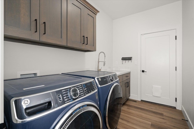 5212 W Decatur Ave, Spokane, WA 99208 - washroom with independent washer and dryer, dark wood-style flooring, cabinet space, and baseboards