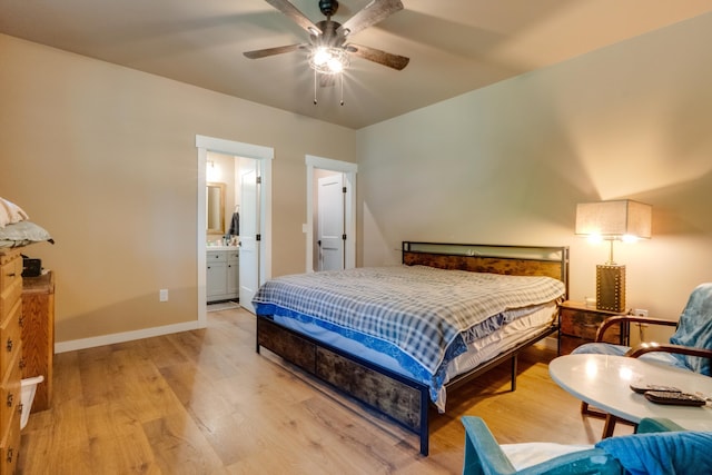 33319 N Conklin Rd, Elk, WA 99009 - bedroom featuring wood finished floors, baseboards, ensuite bathroom, and a ceiling fan