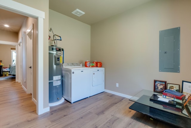 33319 N Conklin Rd, Elk, WA 99009 - laundry room with electric panel, washer and clothes dryer, strapped water heater, light wood finished floors, and recessed lighting