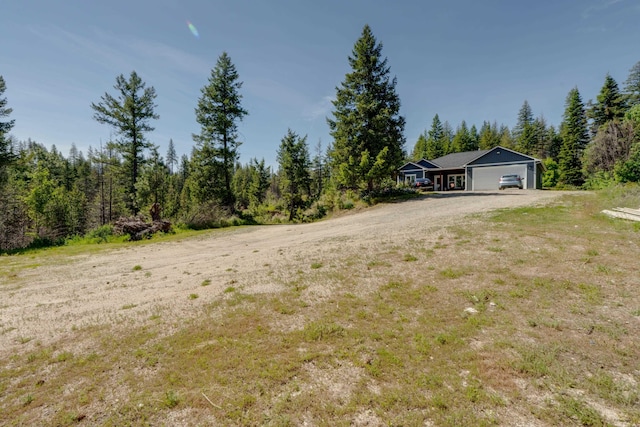 33319 N Conklin Rd, Elk, WA 99009 - view of yard featuring driveway and an attached garage