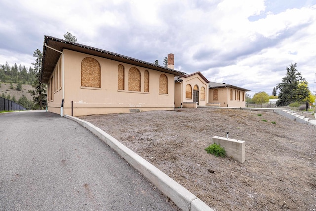 2225 S Inland Empire Way, Spokane, WA 99224 - mediterranean / spanish-style house with a chimney and stucco siding