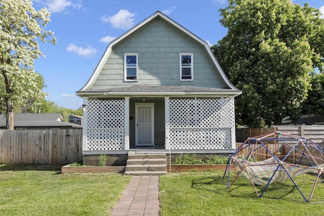 2127 E Mallon Ave, Spokane, WA 99201 - colonial inspired home featuring a gambrel roof, covered porch, and roof with shingles