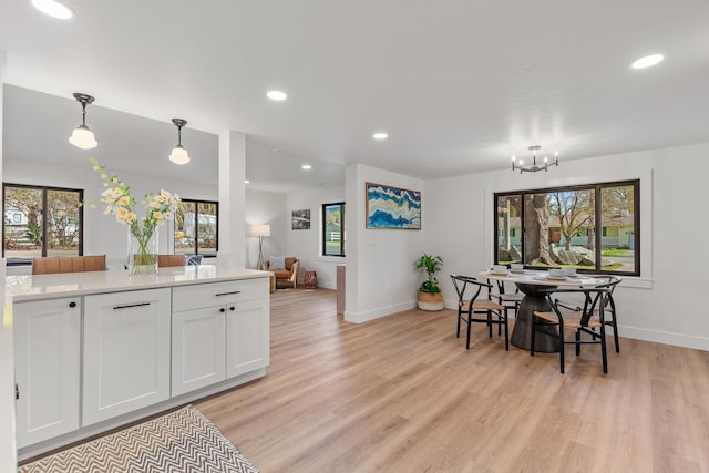 1431 E Miles Ave, Hayden, ID 83835 - dining space featuring baseboards, light wood-type flooring, a chandelier, and recessed lighting