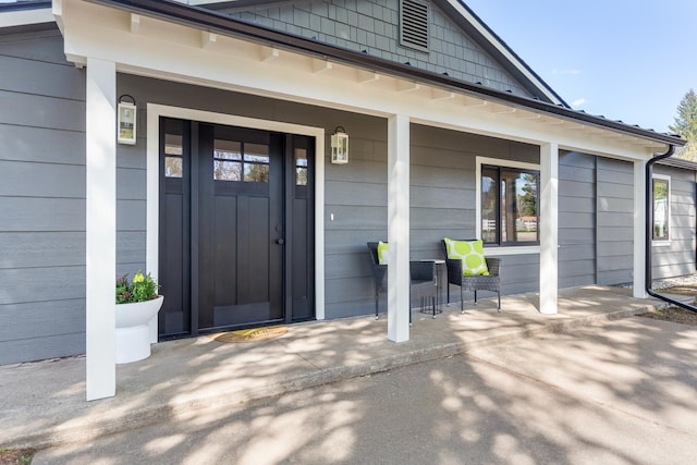 1431 E Miles Ave, Hayden, ID 83835 - doorway to property featuring a porch