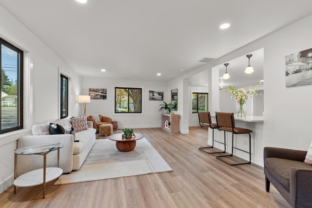 1431 E Miles Ave, Hayden, ID 83835 - living room featuring light wood-style floors, recessed lighting, and baseboards