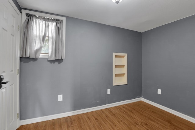 436 N Washington St, Tekoa, WA 99033 - unfurnished room with wood finished floors, baseboards, and built in features