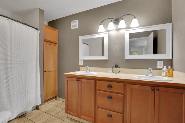 436 N Washington St, Tekoa, WA 99033 - bathroom featuring tile patterned flooring, double vanity, toilet, and curtained shower
