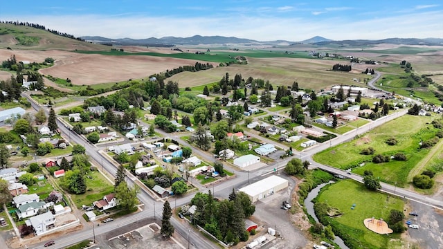 436 N Washington St, Tekoa, WA 99033 - aerial view of property and surrounding area featuring a mountain backdrop