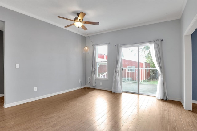 436 N Washington St, Tekoa, WA 99033 - empty room featuring a ceiling fan, light wood-style flooring, baseboards, and ornamental molding