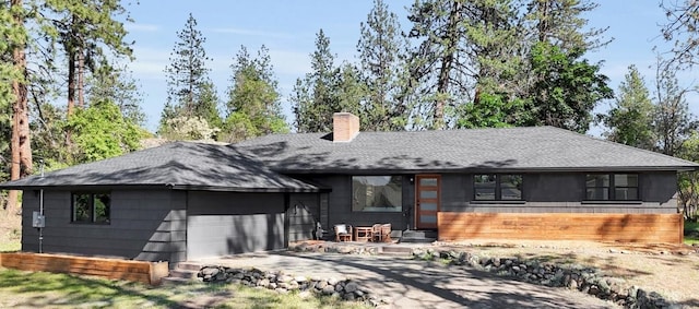 525 S Granite Dr, Spokane Valley, WA 99212 - rear view of house with a chimney and a shingled roof