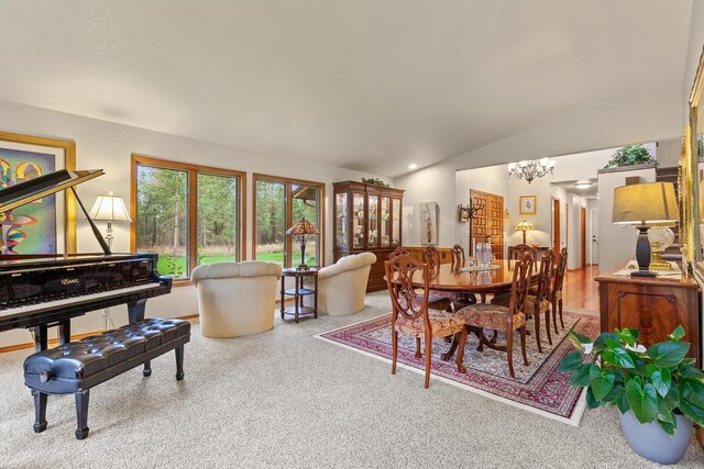 5999 E Roger Dr, Post Falls, ID 83854 - carpeted dining space featuring lofted ceiling and a chandelier