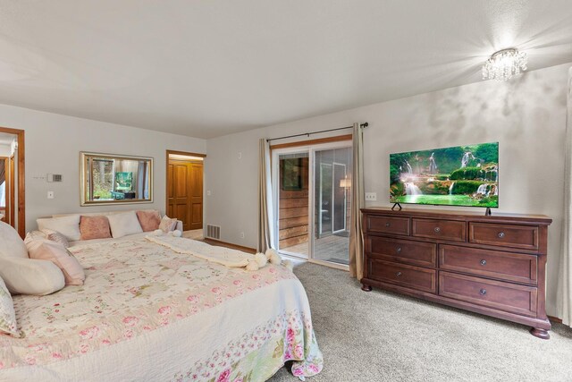 5999 E Roger Dr, Post Falls, ID 83854 - bedroom featuring access to exterior and light carpet