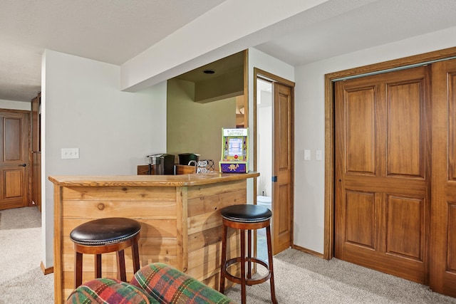 5999 E Roger Dr, Post Falls, ID 83854 - indoor dry bar featuring light carpet and baseboards