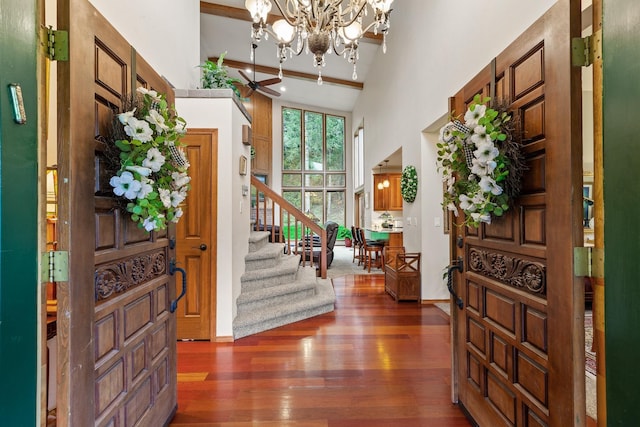 5999 E Roger Dr, Post Falls, ID 83854 - foyer entrance with a towering ceiling, wood-type flooring, stairway, and a chandelier