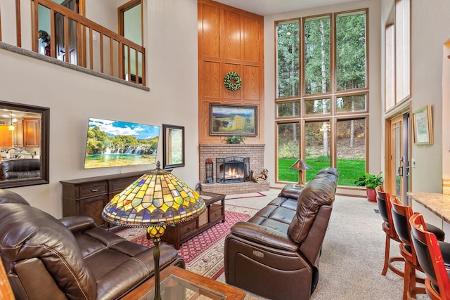 5999 E Roger Dr, Post Falls, ID 83854 - living area with a towering ceiling, healthy amount of natural light, a fireplace, and carpet flooring