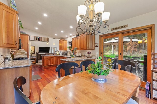 5999 E Roger Dr, Post Falls, ID 83854 - dining room with dark wood-type flooring, vaulted ceiling, recessed lighting, and a chandelier