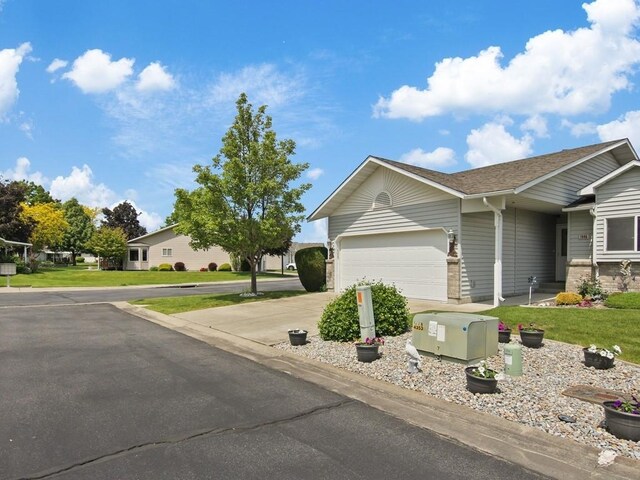 1946 S Century Ln, Spokane Valley, WA 99037 - ranch-style home featuring a garage, driveway, a front yard, and roof with shingles